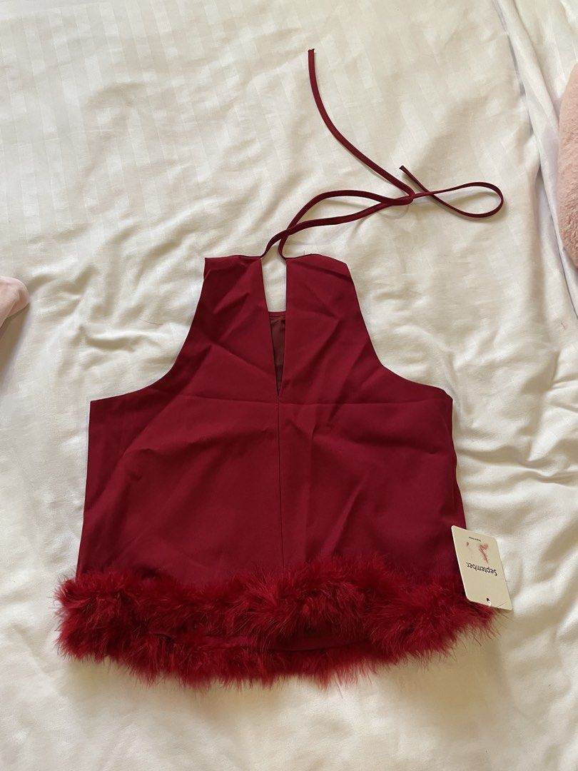 September. Red Feather Trim Halter Neck Crop Top (Category: Others Tops) located in Quezon City. Submitted by csmpau (Listing ID 1441475804, Image 2). Description: -BNWT - Red halter neck crop top - Fun feather trim along the hem - Ties at the neck - Brand new with tags still attached - Ideal for night outs or parties -Bought for 880.