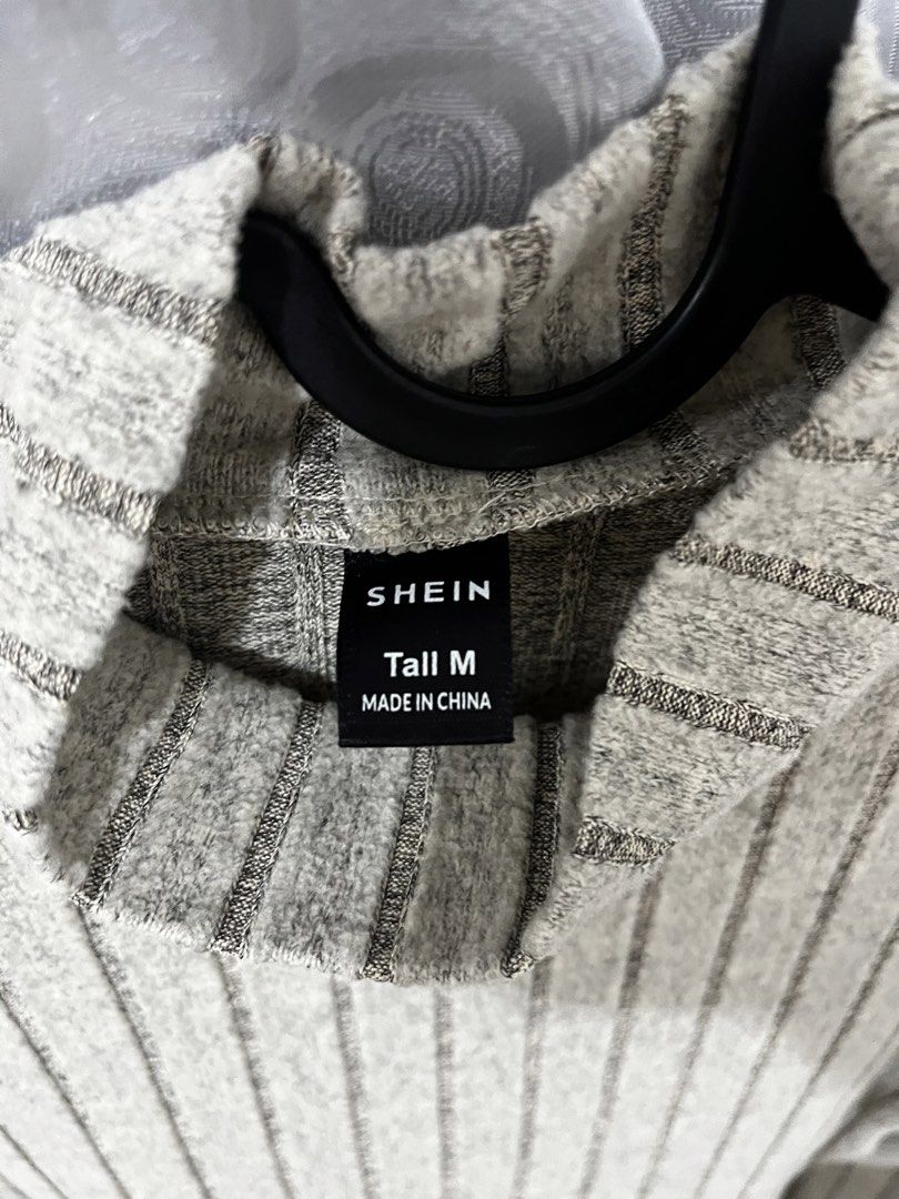 SHEIN Ribbed Mock Neck Long Sleeve Top (Category: Blouses) located in Makati City. Submitted by gabrayco (Listing ID 1441491399, Image 2). Description: - Brand: SHEIN - Style: Ribbed Long Sleeve Top - Neckline: Mock Neck - Pattern: Vertical Stripes - Size: Tall M - Origin: Made in China - Features: Comfortable and versatile - W15 L23.