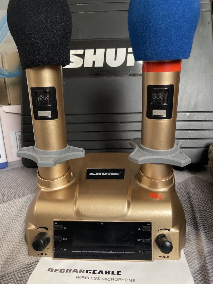 Shure Wireless Rechargeable Microphones with Case (Category: Microphones) located in Las Pinas. Submitted by frugalmama (Listing ID 1441400541, Image 2). Description: - Shure Wireless Rechargeable Microphone Set - Includes 2 microphones with distinct black and blue windscreens - Comes with a convenient charging dock - Protected by a durable hard carrying case - Manual included for easy setup - Ideal for performances, events, and presentations.