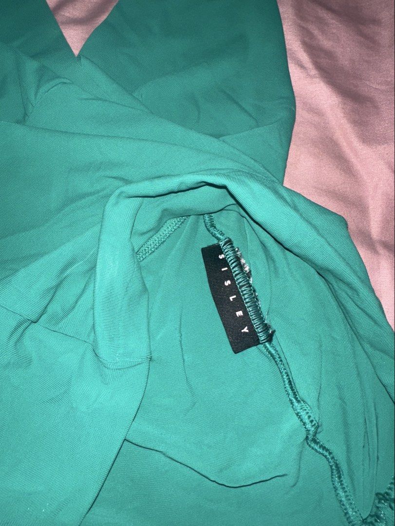 Sisley Green Halter Neck Top (Category: Sleeveless) located in Quezon City. Submitted by _jasminkae (Listing ID 1441500613, Image 2). Description: • Bought from Sisley in Europe • Hand-me-down, never used by me (not flattering since I am flat chested) • Fits a 26 waistline + stretchable!.