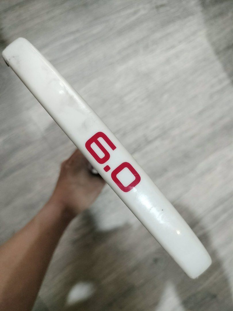 SIXZERO Ruby 6.0 Pickleball Paddle (14mm) (Category: Racket and Ball Sports) located in Quezon City. Submitted by teetharejade (Listing ID 1441472082, Image 3). Description: - SIXZERO Ruby 6.0 pickleball paddle - 14mm - Designed and engineered in the USA - Reliable performance for players - Distinctive maroon surface with geometric patterns - Textured black grip for enhanced handling - no issue to declare, marks seen on the corners are from the e