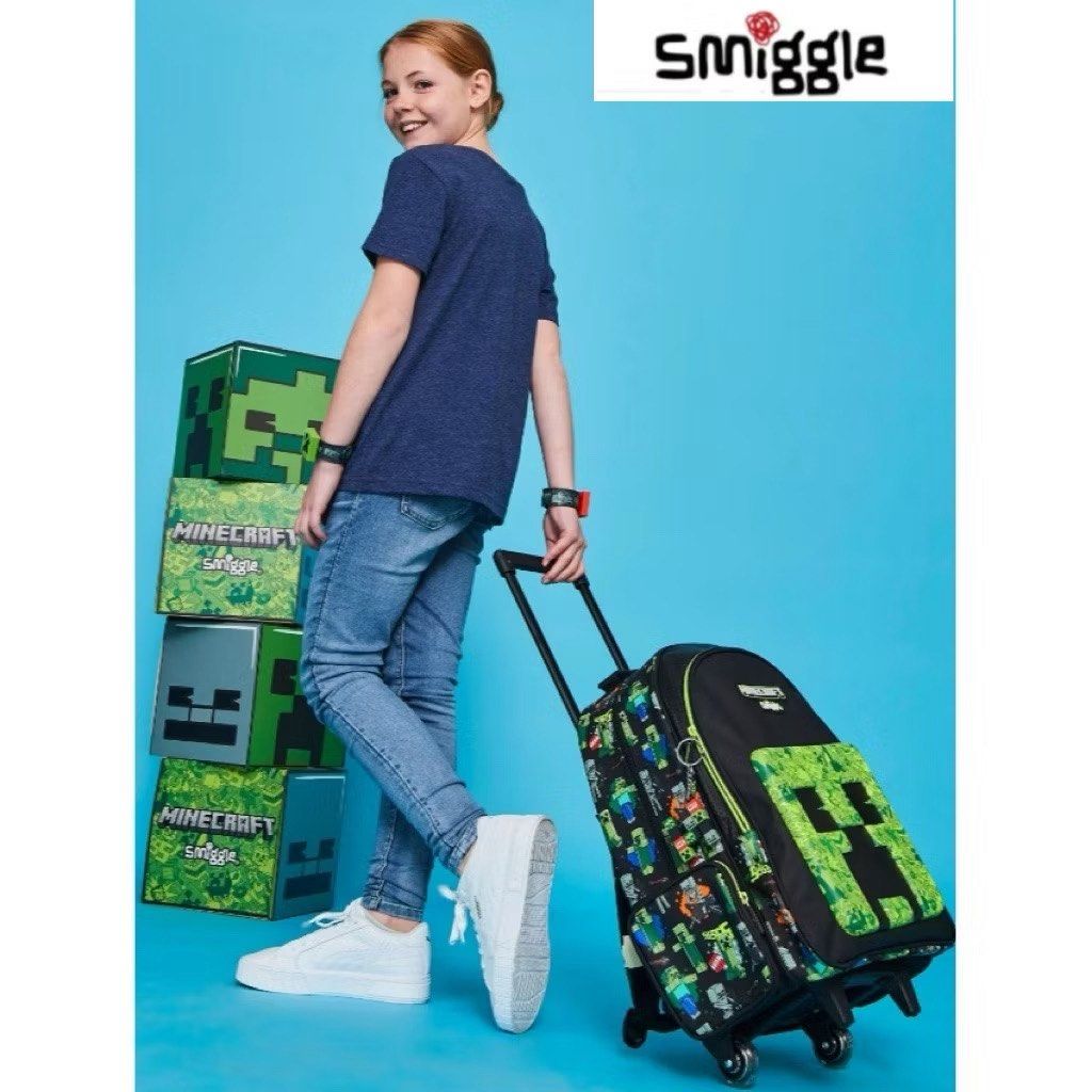 Smiggle Minecraft Rolling Backpack with Wheels (Category: Babies & Kids Fashion) located in Calamba. Submitted by hgrajo (Listing ID 1441494133, Image 3). Description: - Official Smiggle x Minecraft collaboration - Features iconic Creeper face on the front - Fun Minecraft character prints on straps and sides - Built-in wheels for easy rolling - Retractable handle for convenient transport - Ideal for school, travel, or everyday use - Kids will lov