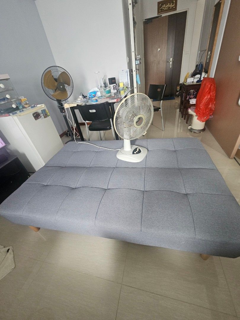 Sofa Bed (Category: Sofas) located in Singapore. Submitted by reddatesdrink (Listing ID 1441513228, Image 3). Description: - Grey tufted sofa bed - Folds out flat for easy conversion - Ideal for small spaces - Durable fabric upholstery - Sturdy wooden legs - Easy to clean material - Perfect for guests or everyday lounging.