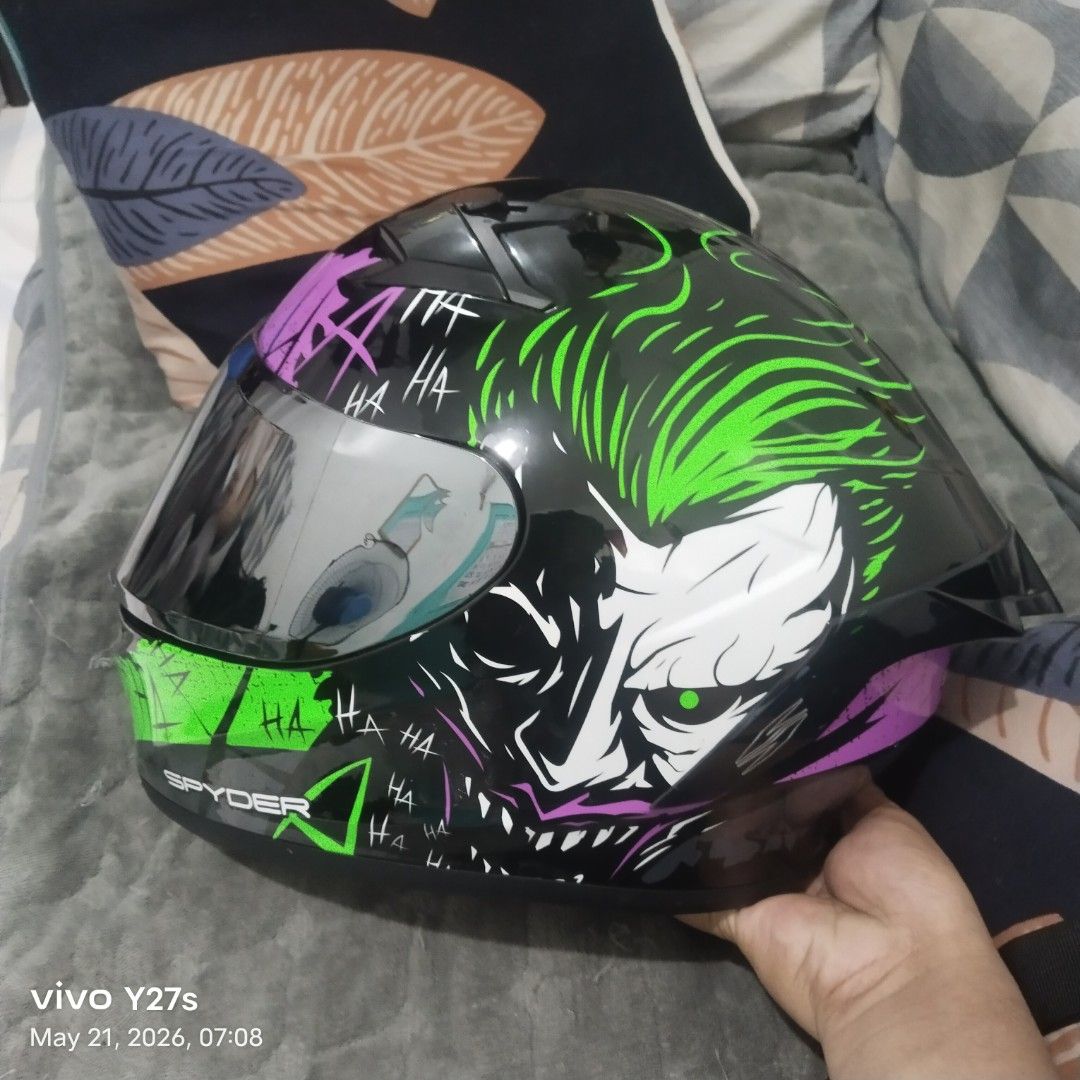 Spyder Helmet - Joker Design (Category: Helmets and other Riding Gears) located in Manila. Submitted by gerancenar91977 (Listing ID 1441543297, Image 3). Description: - Eye-catching Joker design Spyder helmet - Features a mirrored visor for a sleek look - Clean and comfortable interior padding - Perfect for riders who want to make a statement - Ready for your next adventure on the road.