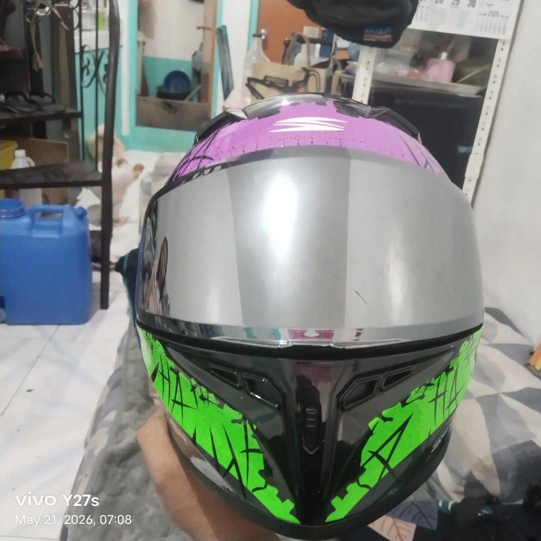Spyder Helmet - Joker Design (Category: Helmets and other Riding Gears) located in Manila. Submitted by gerancenar91977 (Listing ID 1441543297, Image 2). Description: - Eye-catching Joker design Spyder helmet - Features a mirrored visor for a sleek look - Clean and comfortable interior padding - Perfect for riders who want to make a statement - Ready for your next adventure on the road.