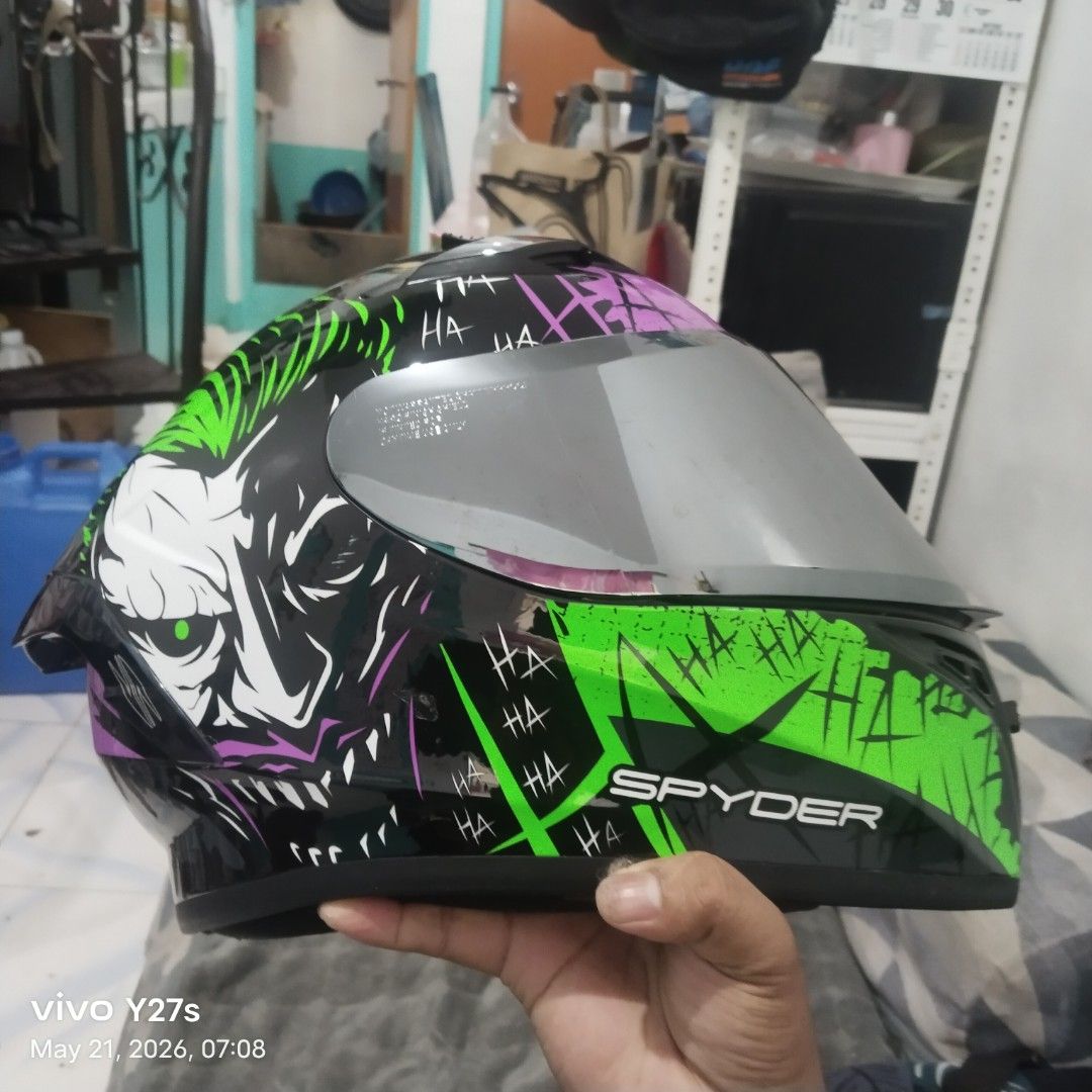 Spyder Helmet - Joker Design (Category: Helmets and other Riding Gears) located in Manila. Submitted by gerancenar91977 (Listing ID 1441543297, Image 1). Description: - Eye-catching Joker design Spyder helmet - Features a mirrored visor for a sleek look - Clean and comfortable interior padding - Perfect for riders who want to make a statement - Ready for your next adventure on the road.