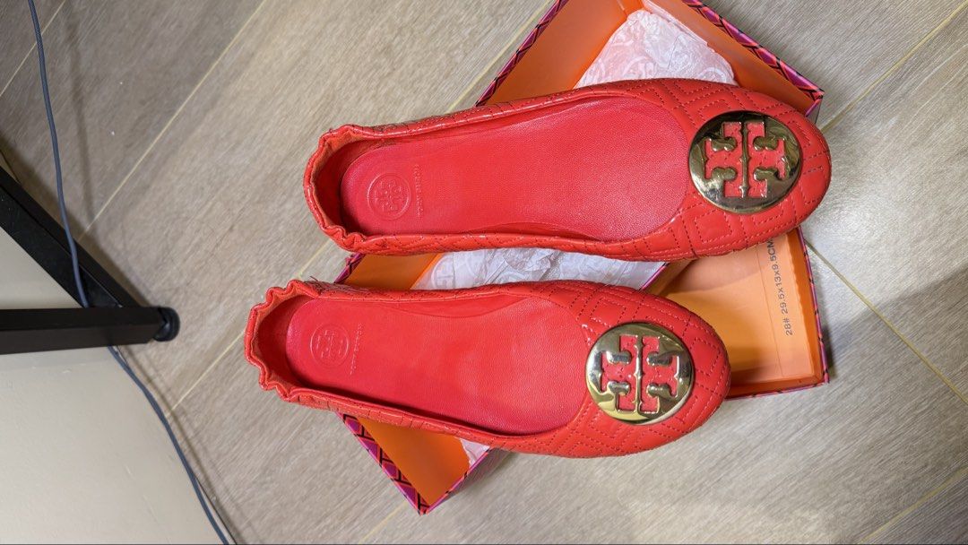 Tory Burch Minnie Quilted Ballet Flats (Category: Flats & Sandals) located in Manila. Submitted by liarawr (Listing ID 1441530352, Image 2). Description: - Red Tory Burch ballet flats - Patent leather with signature gold double T logo - Includes original box - Adds a cute pop of color to any outfit - Easy slip-on style.