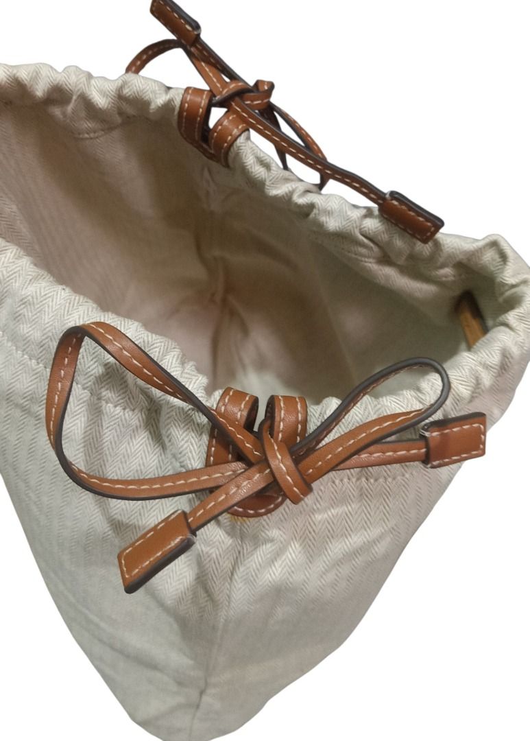 ⚜️Tory Burch String Bucket Bag (Category: Luxury Bags & Wallets) located in Manila. Submitted by 74_tiger (Listing ID 1441471165, Image 2). Description: Item: Tory Burch String Bucket Bag Condition: Like New Material: Canvas Color: Light Mocca Approx Measurement: W - 14" x H - 12.5" 💯% Authentic Pre - Owned Good As New Never Got The Chance To Use It Handy, Can Fit A Lot Inside LAST PRICE POSTED!!!! .