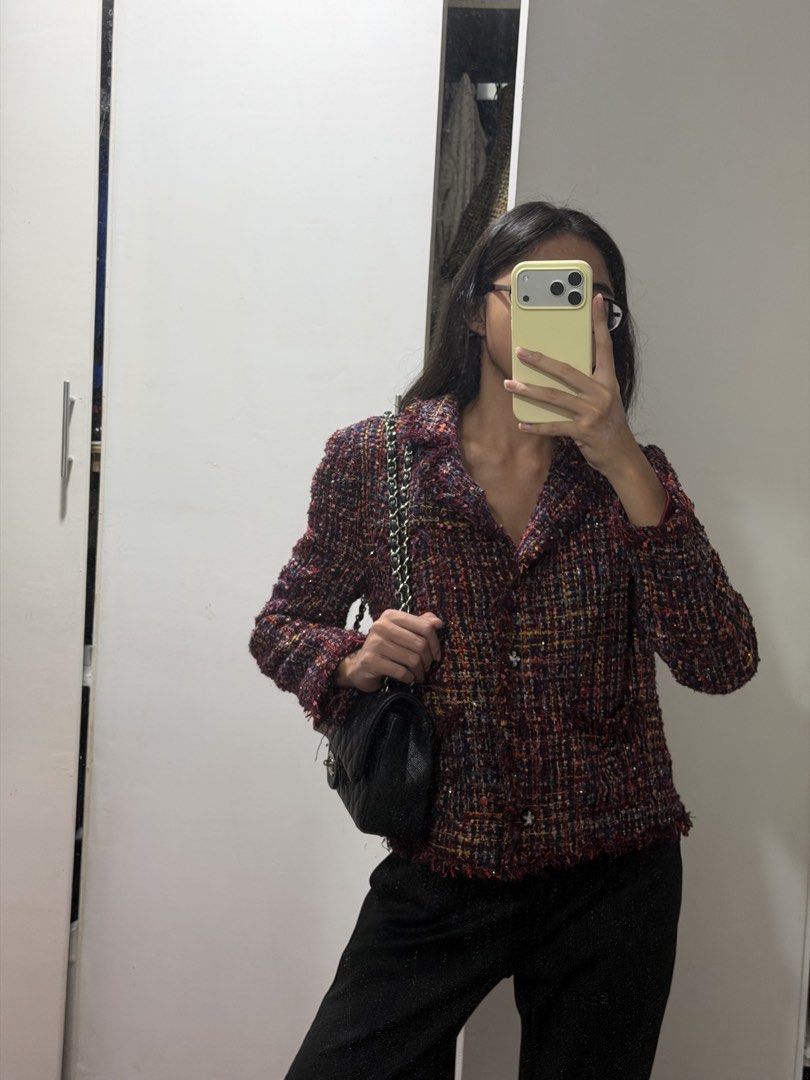 Tweed Cropped Jacket (Category: Coats, Jackets and Outerwear) located in Pasig City. Submitted by miss_abuelita (Listing ID 1441546825, Image 2). Description: - Cropped tweed jacket - Features red, blue, and yellow threads - Button-up front - Two front pockets - Stylish fringe details - Versatile for pairing with trousers or jeans - Adds a pop of color and chic layering to any outfit.