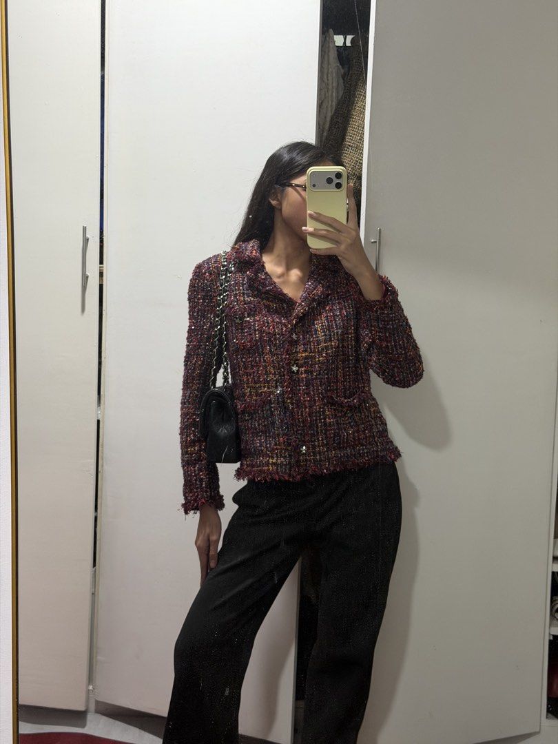 Tweed Cropped Jacket (Category: Coats, Jackets and Outerwear) located in Pasig City. Submitted by miss_abuelita (Listing ID 1441546825, Image 1). Description: - Cropped tweed jacket - Features red, blue, and yellow threads - Button-up front - Two front pockets - Stylish fringe details - Versatile for pairing with trousers or jeans - Adds a pop of color and chic layering to any outfit.