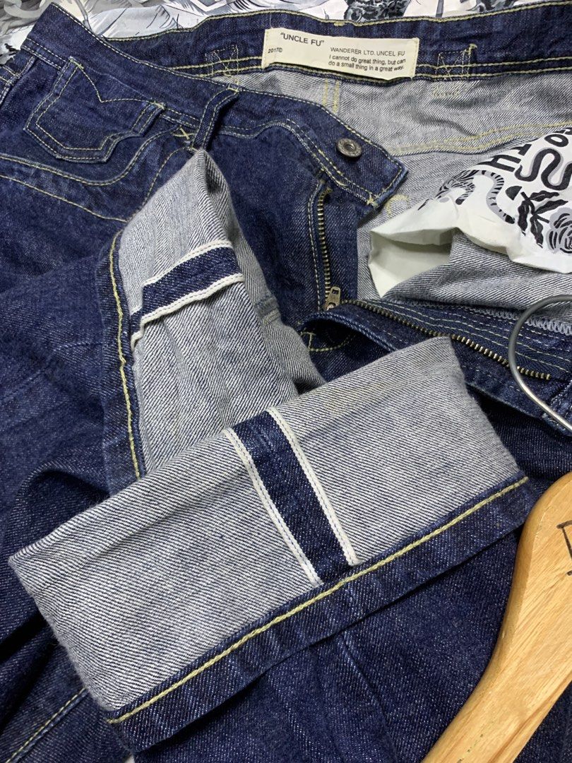 Uncle Fu Wanderer Ltd. Selvedge Denim Jeans (Category: Jeans) located in Polomolok. Submitted by domingthriftclothes (Listing ID 1441399599, Image 2). Description: - Size 34-36 - Brand: Uncle Fu - Style: Dark wash denim jeans - Design: Classic five-pocket - Stitching: Yellow contrast stitching - Closure: Button fly - Special Detail: Contrasting grey fabric with selvedge detailing on inside cuff - Manufacturer: Wanderer Ltd..