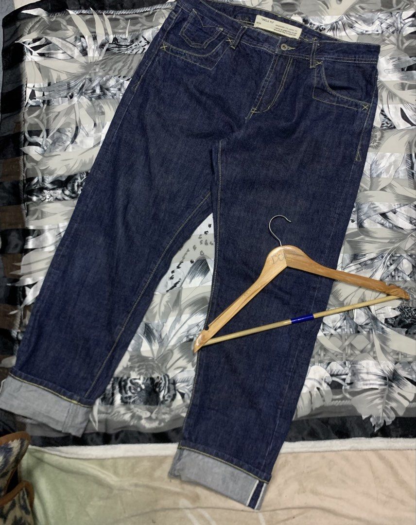 Uncle Fu Wanderer Ltd. Selvedge Denim Jeans (Category: Jeans) located in Polomolok. Submitted by domingthriftclothes (Listing ID 1441399599, Image 3). Description: - Size 34-36 - Brand: Uncle Fu - Style: Dark wash denim jeans - Design: Classic five-pocket - Stitching: Yellow contrast stitching - Closure: Button fly - Special Detail: Contrasting grey fabric with selvedge detailing on inside cuff - Manufacturer: Wanderer Ltd..