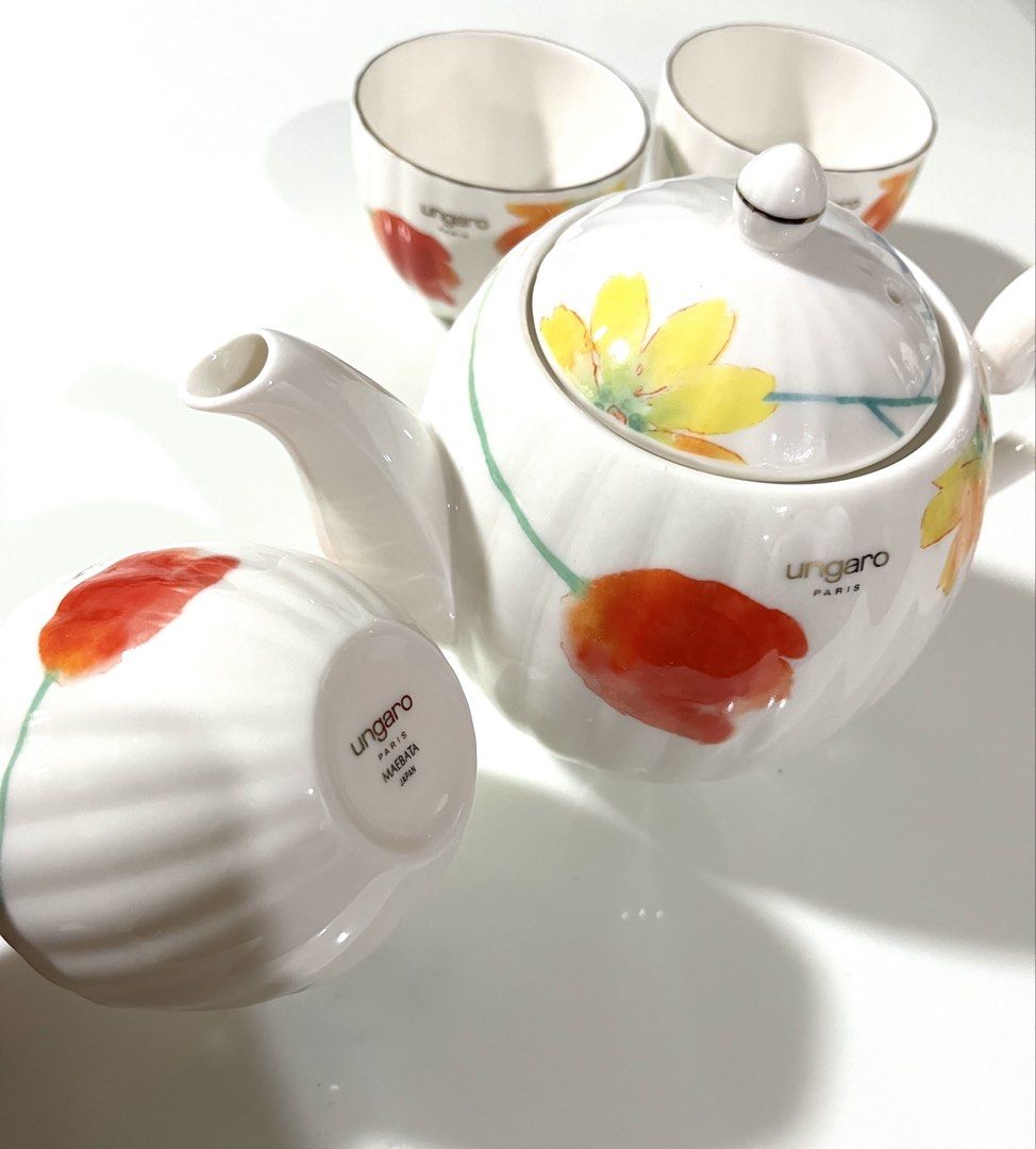 Ungaro Maebata Japan Floral Tea Set (Category: Coffee & Tea Tableware) located in Pasig City. Submitted by tylernchloe (Listing ID 1441383339, Image 2). Description: - Beautiful Ungaro Paris Maebata Japan teapot and 3 teacups - Lovely summer floral design with red, yellow, and blue flowers - Features a ribbed texture on teapot and cups.