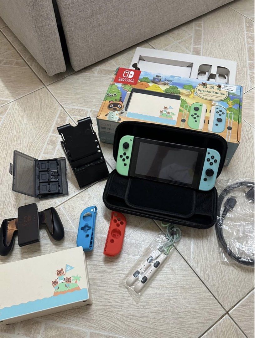 V2 Nintendo Switch SET Animal Crossing Edition (Category: Nintendo) located in Manila. Submitted by liahmi (Listing ID 1441541809, Image 2). Description: LIMITED EDITION ANIMAL CROSSING NINTENDO SWITCH V2 SET❤️ -SELLING PRICE: 12,000 -ORIGINAL PRICE: 15,995 (no accessories yet) INCLUSIONS: •switch •case •controller -2 joycon •hdmi cable •switch dock •game case •charger (slightly flawed) •stand •grip handles •FREE SPEAKER Games included: -Resident