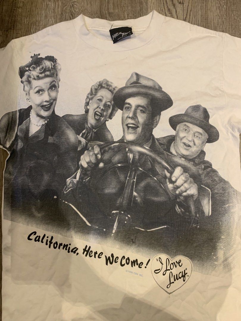 Vintage 1992 I Love Lucy California Here We Come T-Shirt (Category: Tshirts & Polo Shirts ) located in Manila. Submitted by fieldthrift09 (Listing ID 1441487856, Image 1). Description: - Vintage I Love Lucy T-Shirt - Features graphic of the I Love Lucy cast - "California, Here We Come!" and "I Love Lucy" text - Copyright 1992 CBS Inc. - Tagged Size: L - Made in USA by Marlin Tease.