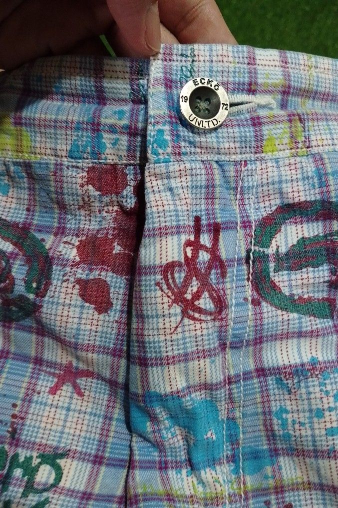 Vintage ECKO UNLTD. Plaid Graffiti Print Shorts (Category: Shorts) located in Manila. Submitted by patrickjos06722 (Listing ID 1441568618, Image 3). Description: - Brand: ECKO UNLTD. - Design: Plaid and graffiti print with all-over rhino logo. - Closure: Zip fly. - Pockets: Two back pockets. - Style: Great for casual wear, unique design. - Condition: Please check photos for details. - Unique and rare print.