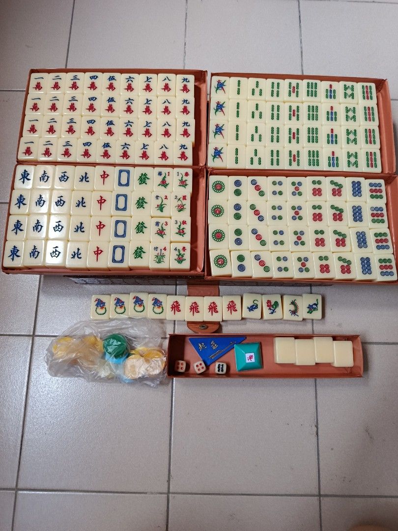 Vintage Mahjong Set with Case (Category: Toys & Games) located in Singapore. Submitted by karhar99 (Listing ID 1441462716, Image 2). Description: - Complete Mahjong set 160 tiles - Includes animals, joker head, 飛 and blank tiles - Comes with brown carry case, dice, wind direction indicator and chips - deal at Bukit batok mrt or 65018x.