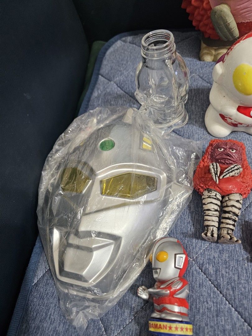 Vintage Ultraman Figures and Accessories Set (Category: Action & Battle Toys) located in Muntinlupa City. Submitted by jojiepogi123 (Listing ID 1441532107, Image 3). Description: - Collection of Ultraman toys and accessories - Includes various figures, some with detachable parts - Features a large silver vehicle or accessory - Comes with clear plastic bottle-like pieces - Ideal for Ultraman collectors and fans - Some items are still in original p