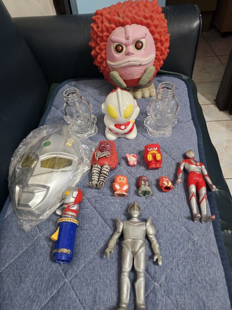 Vintage Ultraman Figures and Accessories Set (Category: Action & Battle Toys) located in Muntinlupa City. Submitted by jojiepogi123 (Listing ID 1441532107, Image 2). Description: - Collection of Ultraman toys and accessories - Includes various figures, some with detachable parts - Features a large silver vehicle or accessory - Comes with clear plastic bottle-like pieces - Ideal for Ultraman collectors and fans - Some items are still in original p