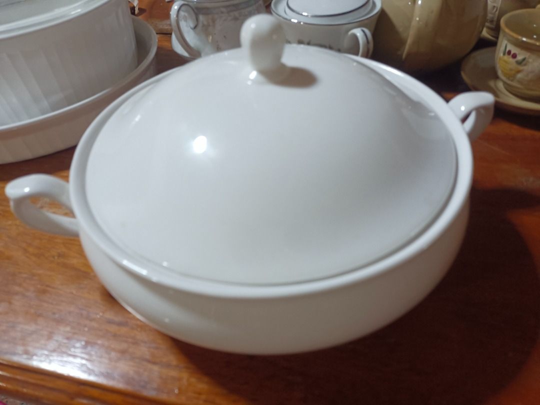 Vintage White Ceramic Serving Bowl with Lid (Category: Dinnerware & Cutlery) located in Caloocan City. Submitted by ibyang888 (Listing ID 1441583476, Image 2). Description: - White ceramic serving bowl - Includes a lid - Features two side handles - Ideal for serving soups or stews - Clean and simple design - Perfect for dinner parties.