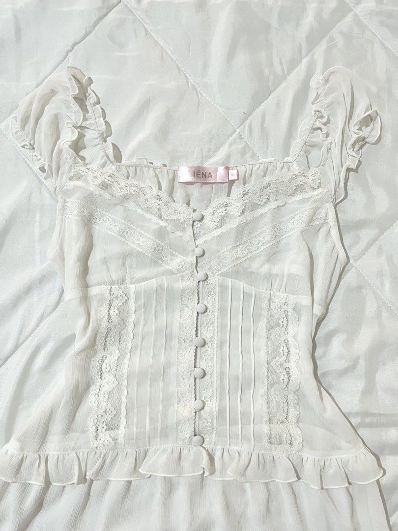 White Ruffle Lace Button Up See-Through Dress (Category: Dresses) located in Naga. Submitted by itsrhoda (Listing ID 1441387766, Image 2). Description: ✨ Every item is washed. ✨ Manage your expectations, as these are preloved! Expect minimal flaws. View photos in comments to see details and/or issues (if there are any)/ask the seller. ✨ Color may vary due to lighting. - S on Tag - White mini dress from IENA - Square neckline with ruffles and lace