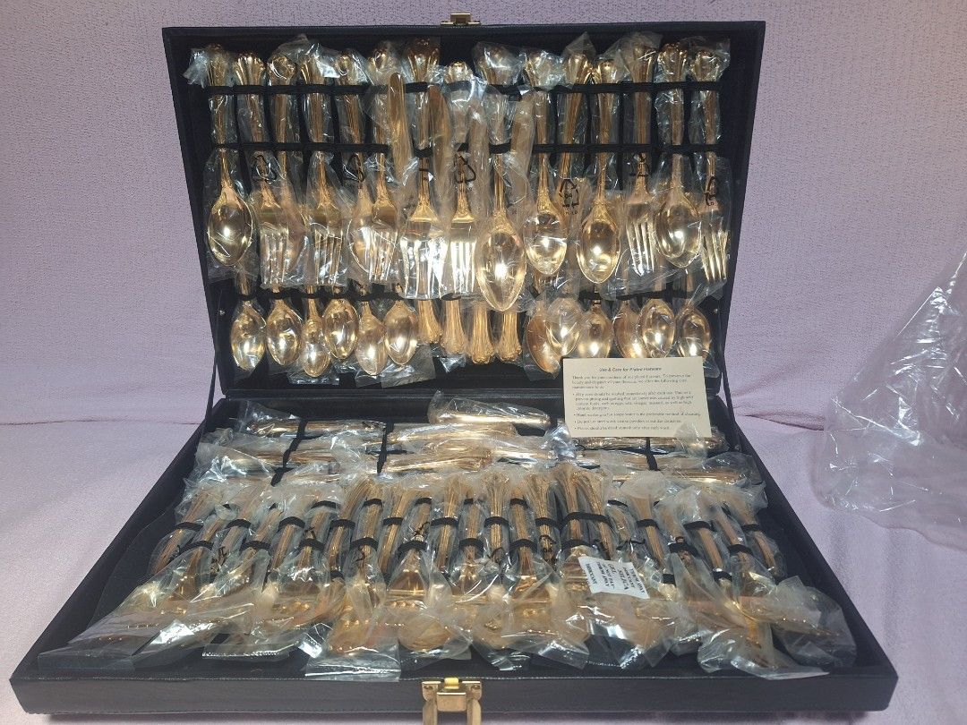 William Rogers and Son Goldplated Flatware Set 62 Piece (Category: Dinnerware & Cutlery) located in Baguio. Submitted by be_blessed_boutique (Listing ID 1441512786, Image 1). Description: - Complete 62-piece gold-plated flatware set - Brand: William Rogers And Son - Pattern: Enchanted - All pieces individually wrapped in plastic - Includes a black storage case - Ideal for formal dining and special occasions - Full set for 8 people.