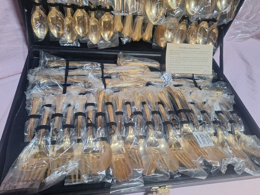 William Rogers and Son Goldplated Flatware Set 62 Piece (Category: Dinnerware & Cutlery) located in Baguio. Submitted by be_blessed_boutique (Listing ID 1441512786, Image 3). Description: - Complete 62-piece gold-plated flatware set - Brand: William Rogers And Son - Pattern: Enchanted - All pieces individually wrapped in plastic - Includes a black storage case - Ideal for formal dining and special occasions - Full set for 8 people.