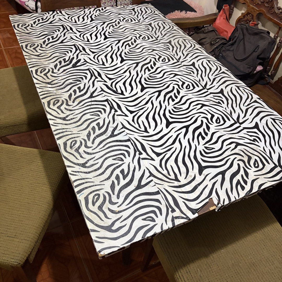 Wooden Dining Table w/ Foamed Chair (Category: Tables & Sets) located in Rizal. Submitted by _poknat (Listing ID 1441494010, Image 3). Description: Wooden dining table with removable zebra print sticker, with 6 wooden chairs (olive green seat foams) Flaws: Seen in pictures, chips in wood as well as stains in foam chairs..