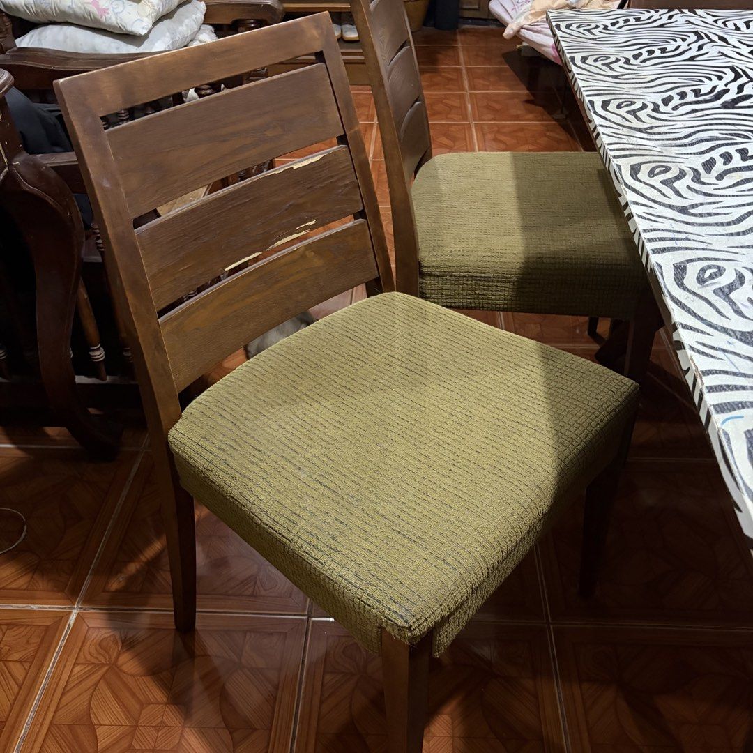 Wooden Dining Table w/ Foamed Chair (Category: Tables & Sets) located in Rizal. Submitted by _poknat (Listing ID 1441494010, Image 2). Description: Wooden dining table with removable zebra print sticker, with 6 wooden chairs (olive green seat foams) Flaws: Seen in pictures, chips in wood as well as stains in foam chairs..