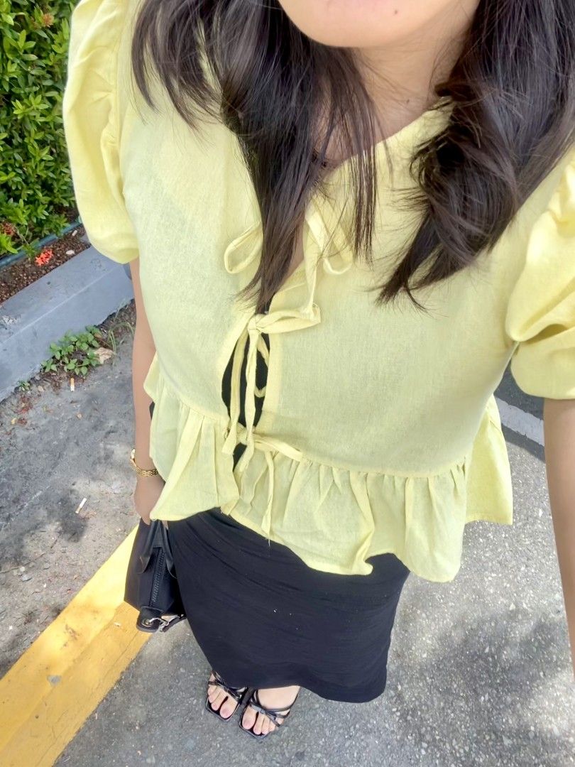 Yellow Self-Tie Ribbon Peplum Top (Category: Blouses) located in Meycauayan. Submitted by shescelsshesells (Listing ID 1441404216, Image 2). Description: Yellow Self-Tie Ribbon Peplum Top Brand: Dominique & Co Size: XS Color: Yellow PAYO ONLY. MOD: LALAMOVE/J&T MOP: GCASH/MAYA/MARIBANK/GOTYME The customer will shoulder the mailing and delivery service. You can opt to book your own choice of delivery service provider..