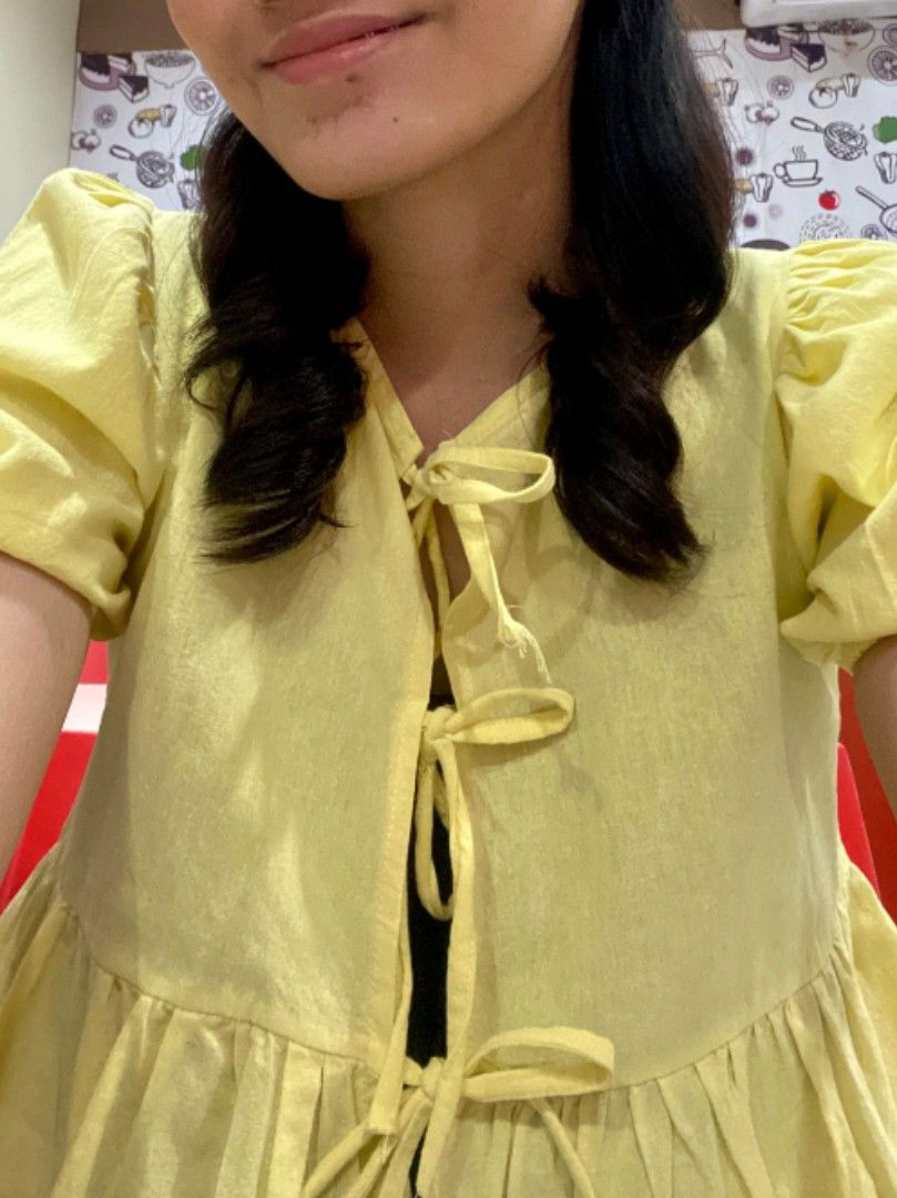 Yellow Self-Tie Ribbon Peplum Top (Category: Blouses) located in Meycauayan. Submitted by shescelsshesells (Listing ID 1441404216, Image 3). Description: Yellow Self-Tie Ribbon Peplum Top Brand: Dominique & Co Size: XS Color: Yellow PAYO ONLY. MOD: LALAMOVE/J&T MOP: GCASH/MAYA/MARIBANK/GOTYME The customer will shoulder the mailing and delivery service. You can opt to book your own choice of delivery service provider..