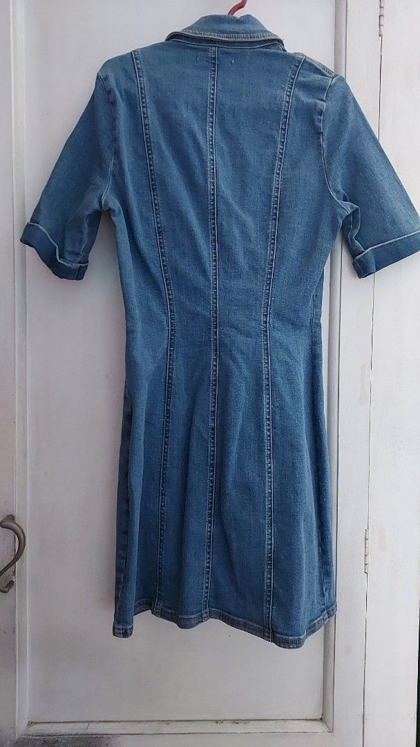 Zara Authentic Denim by TRF Dress (Category: Dresses) located in Quezon City. Submitted by petite.declutters (Listing ID 1441390328, Image 2). Description: - Authentic Zara Denim by TRF dress - Classic blue denim - Button-up front with unique colorful buttons - Two functional chest pockets - Short sleeves - Ideal for everyday casual style.