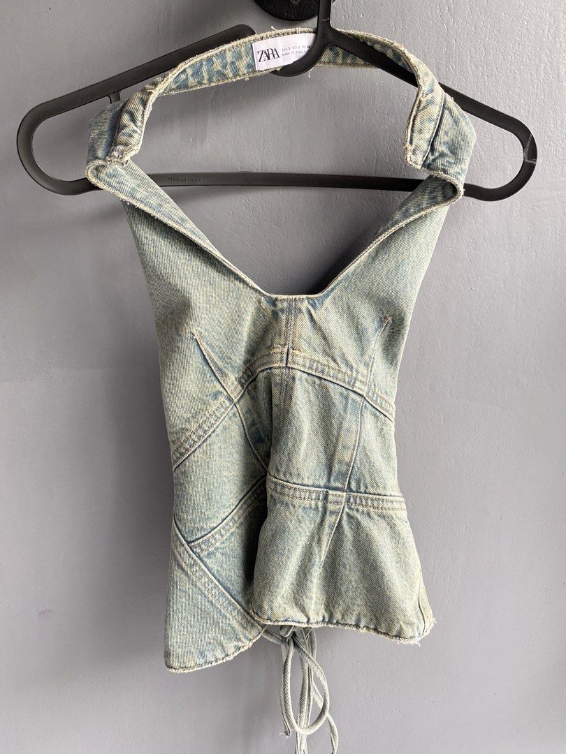 ZARA Light Wash Denim Halter Top (Category: Sleeveless) located in Manila. Submitted by riee.18 (Listing ID 1441482042, Image 1). Description: - ZARA light wash denim halter top - Unique paneling design - Tie-up back for adjustable fit - Versatile: pairs well with jeans or skirts - A stylish addition to your wardrobe.