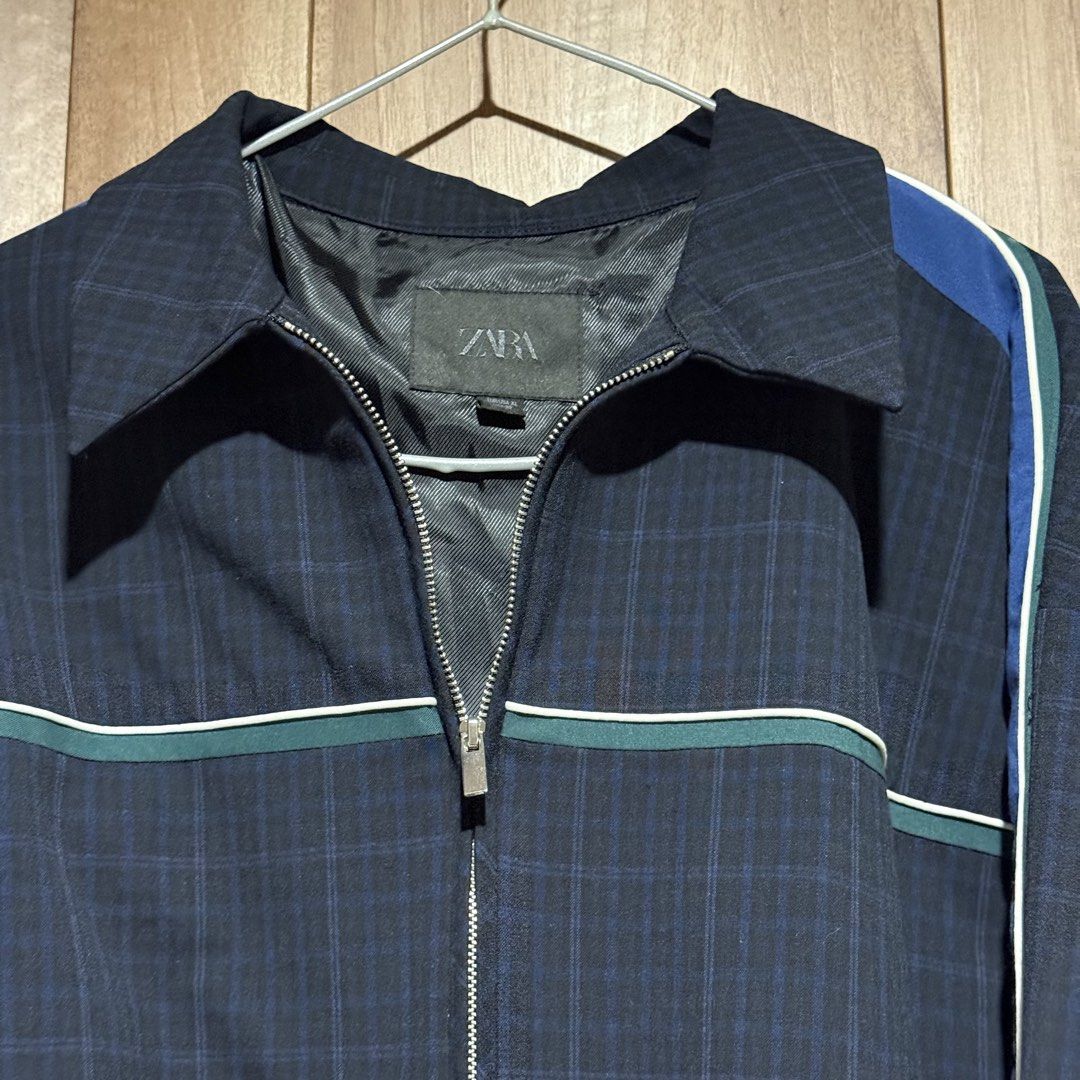 Zara Plaid Zip-Up Jacket with Striped Sleeves (Category: Coats, Jackets and Outerwear) located in Caloocan City. Submitted by paulajoson (Listing ID 1441554434, Image 3). Description: - Used once - Zara jacket with a stylish plaid pattern. - Sporty stripes in blue, green, and white accent the sleeves. - Full zip-up front with a classic collar. - Elasticated cuffs and hem for a comfortable fit. - Ideal for everyday casual wear. - Size: XL, loose f