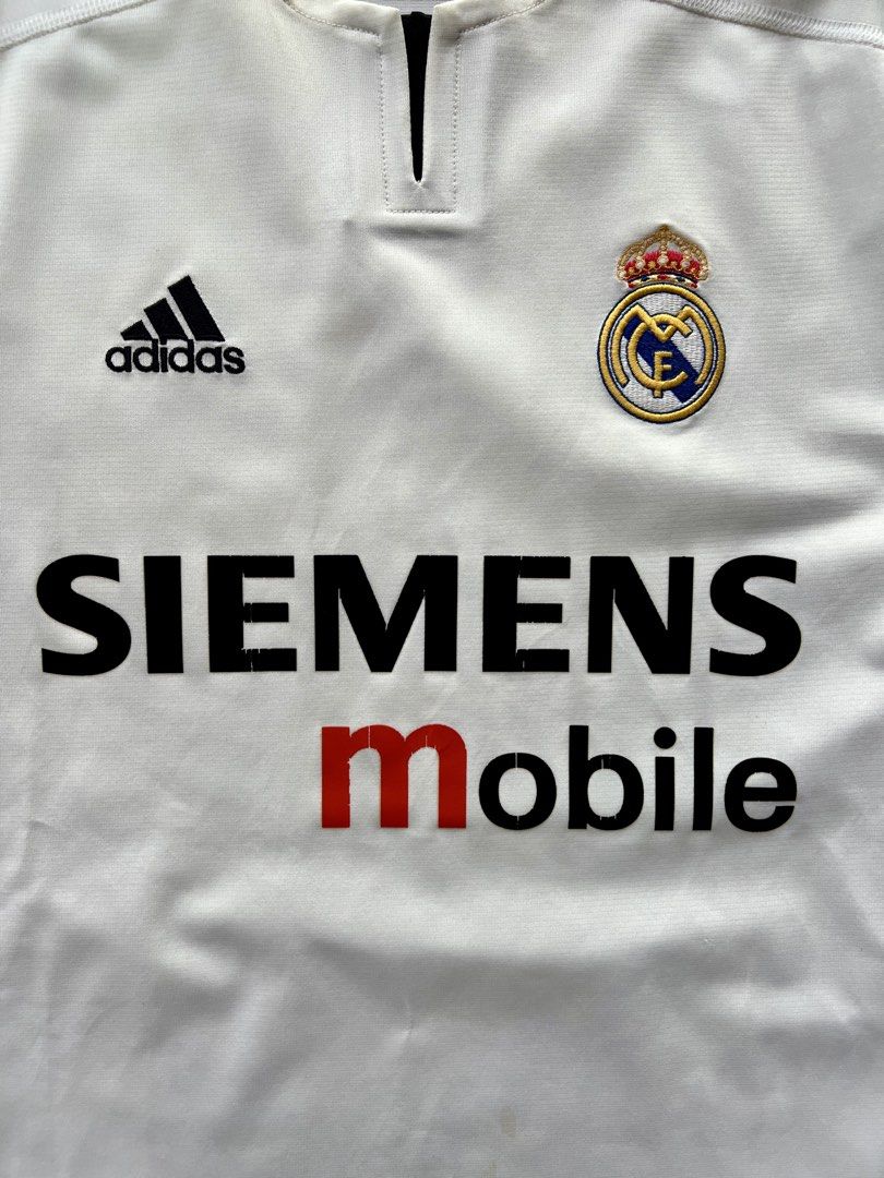 2003/04 Real Madrid ‘Asian Tour’ Home Shirt - #23 BECKHAM /football jersey/ kit rare/ retro/ vintage (Category: Activewear) located in Singapore. Submitted by jskitcult (Listing ID 1444911793, Image 3). Description: Product Size: M PTP: 56cm Length: 71cm Condition: Excellent Brand: Adidas Defects: Partial wear on the sponsor logo. Features: Features a rare and special Chinese Nameset of Beckham that was produced for the real madrid asian tour. Th