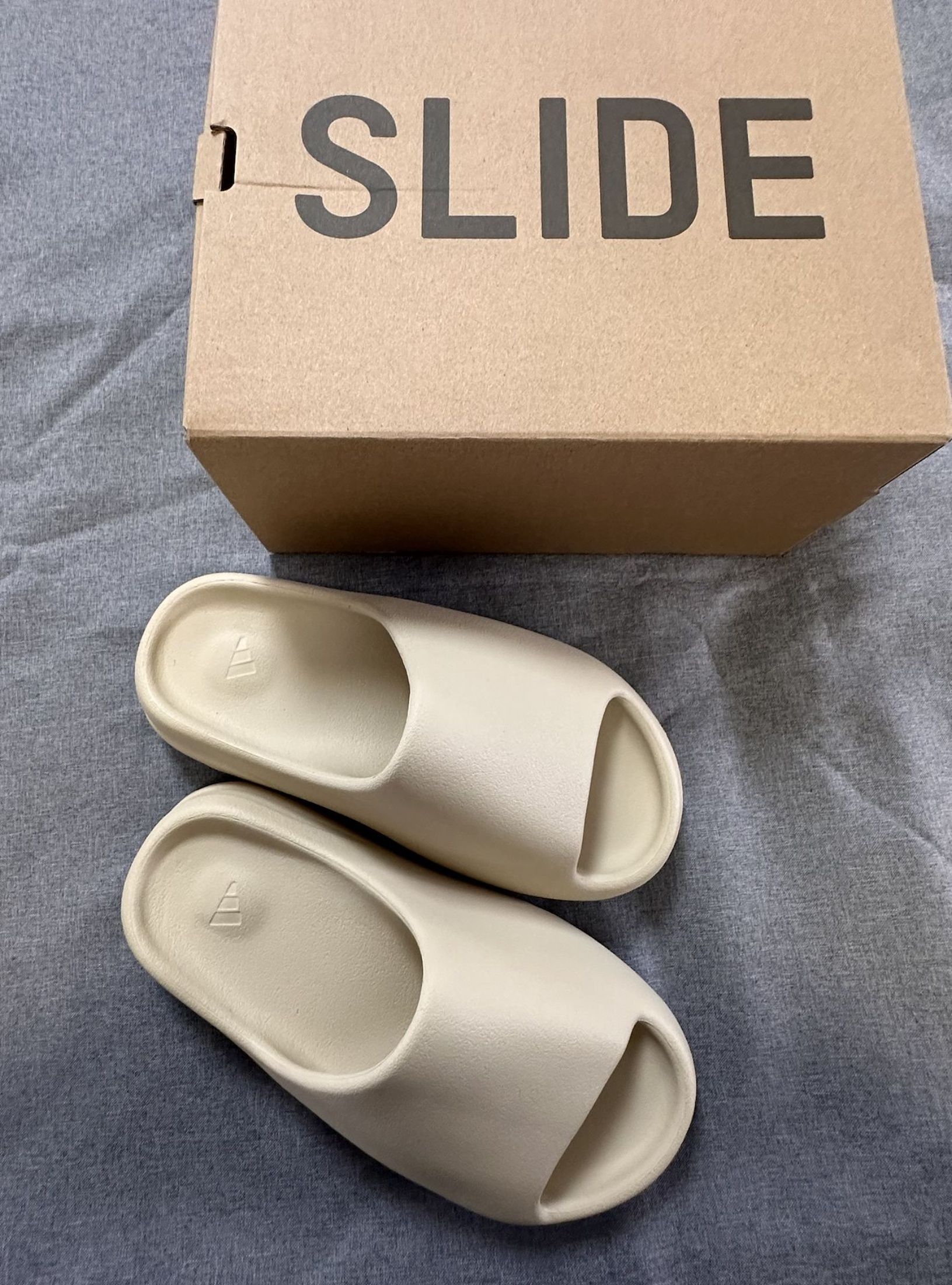 adidas Originals Yeezy Slide and EVA Slip-on Sandals (Category: Sneakers) located in Singapore. Submitted by keenwater-b0b8 (Listing ID 1444865398, Image 2). Description: ★ Adidas ★ adidas Originals Yeezy Slide and EVA Slip-on Sandals Brand New Free Shipping (J&T/Ninja Van) Cash on Delivery 📌 No meetup 📸 3-day photo confirm.
