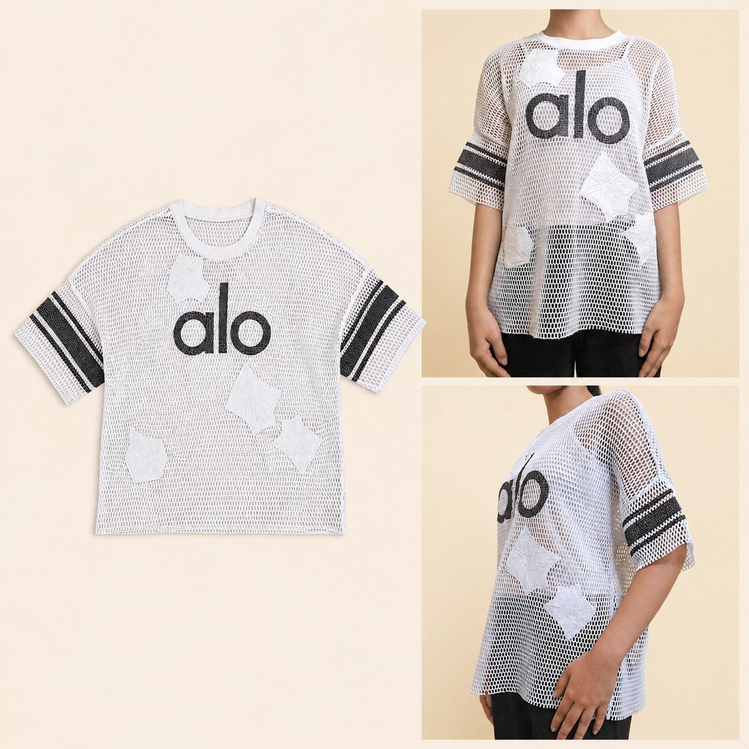 Alo White Mesh T-shirt with Patches and Stripes (Category: Shirts) located in Mandaluyong City. Submitted by timbc (Listing ID 1445021102, Image 1). Description: - Authentic Alo white mesh t-shirt - Features iconic black Alo logo - Unique scattered white patches for a distinctive look - Stylish striped details on the sleeves - Versatile: great for layering or as a statement piece - Made with comfortable and breathable material -Loose fit -100% au