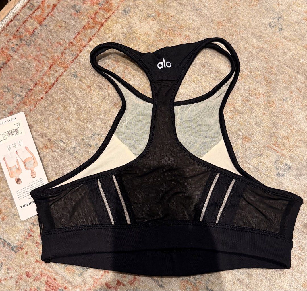 Alo Yoga Half Moon Bra Black Mesh Halter Size S (Category: Activewear) located in Singapore. Submitted by smkmirrors (Listing ID 1444978246, Image 2). Description: - Alo Yoga Half Moon Bra - Colour: Black - Halter silhouette with mesh fabric blocking - Trim detailing and binding at armholes and neckline - Moisture-wicking and anti-microbial properties - 4-way stretch fabric for comfort and flexibility - Suitable for workouts and everyday wear.