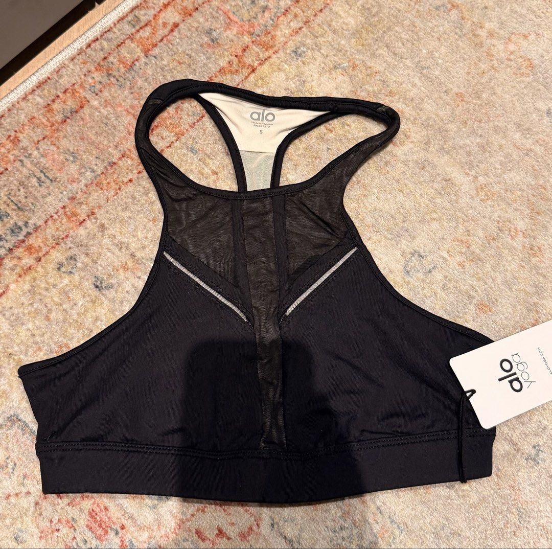 Alo Yoga Half Moon Bra Black Mesh Halter Size S (Category: Activewear) located in Singapore. Submitted by smkmirrors (Listing ID 1444978246, Image 1). Description: - Alo Yoga Half Moon Bra - Colour: Black - Halter silhouette with mesh fabric blocking - Trim detailing and binding at armholes and neckline - Moisture-wicking and anti-microbial properties - 4-way stretch fabric for comfort and flexibility - Suitable for workouts and everyday wear.