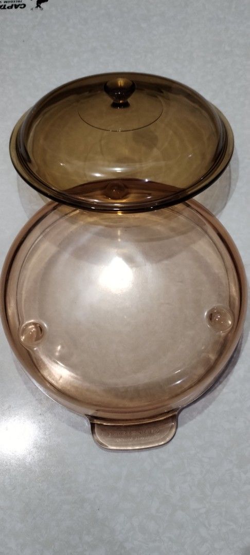 Amber Glass Casserole Dish with Lid (Category: Dinnerware & Cutlery) located in Caloocan City. Submitted by rowely_jpn (Listing ID 1444955518, Image 2). Description: Amber glass casserole dish. Comes with a matching glass lid. Great for baking or serving. Dishwasher safe. Measures approximately 8 inches in diameter and 4 inches deep. Perfect for your kitchen needs. Sturdy handles for easy carrying. Priority take all .vision and Pyrex ..