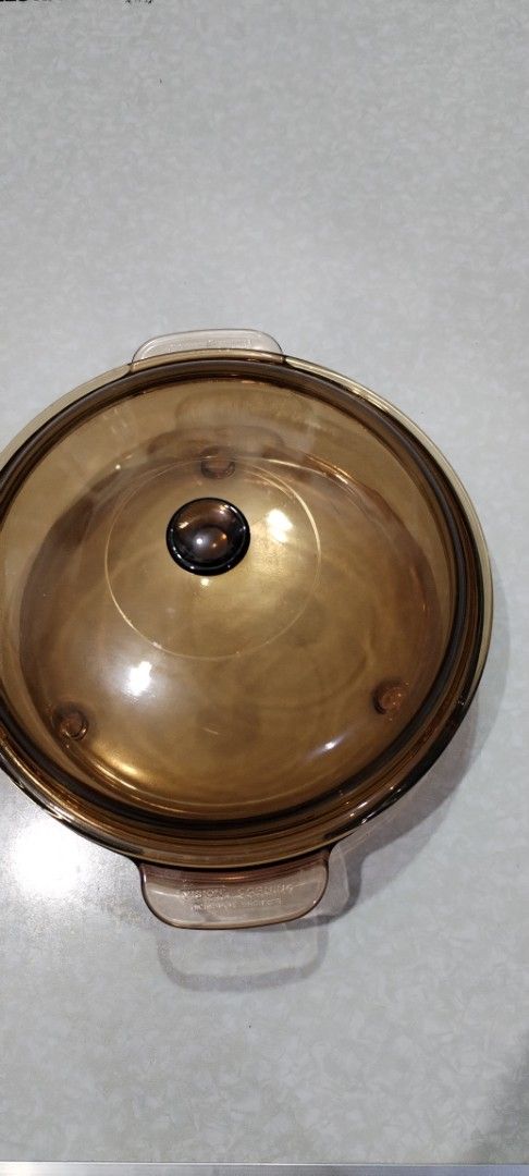 Amber Glass Casserole Dish with Lid (Category: Dinnerware & Cutlery) located in Caloocan City. Submitted by rowely_jpn (Listing ID 1444955518, Image 1). Description: Amber glass casserole dish. Comes with a matching glass lid. Great for baking or serving. Dishwasher safe. Measures approximately 8 inches in diameter and 4 inches deep. Perfect for your kitchen needs. Sturdy handles for easy carrying. Priority take all .vision and Pyrex ..
