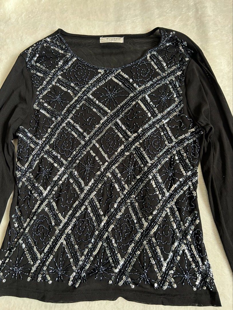 Ansel Classic Black Beaded Long Sleeve Top (Category: Longsleeves) located in Santa Ana. Submitted by 999h03 (Listing ID 1444872433, Image 2). Description: - Black long sleeve top -xs-m - Intricate silver and blue beadwork on front (diamond pattern with floral accents) - Sheer mesh sleeves - Slightly curved hemline - Ideal for night outs or special occasions.