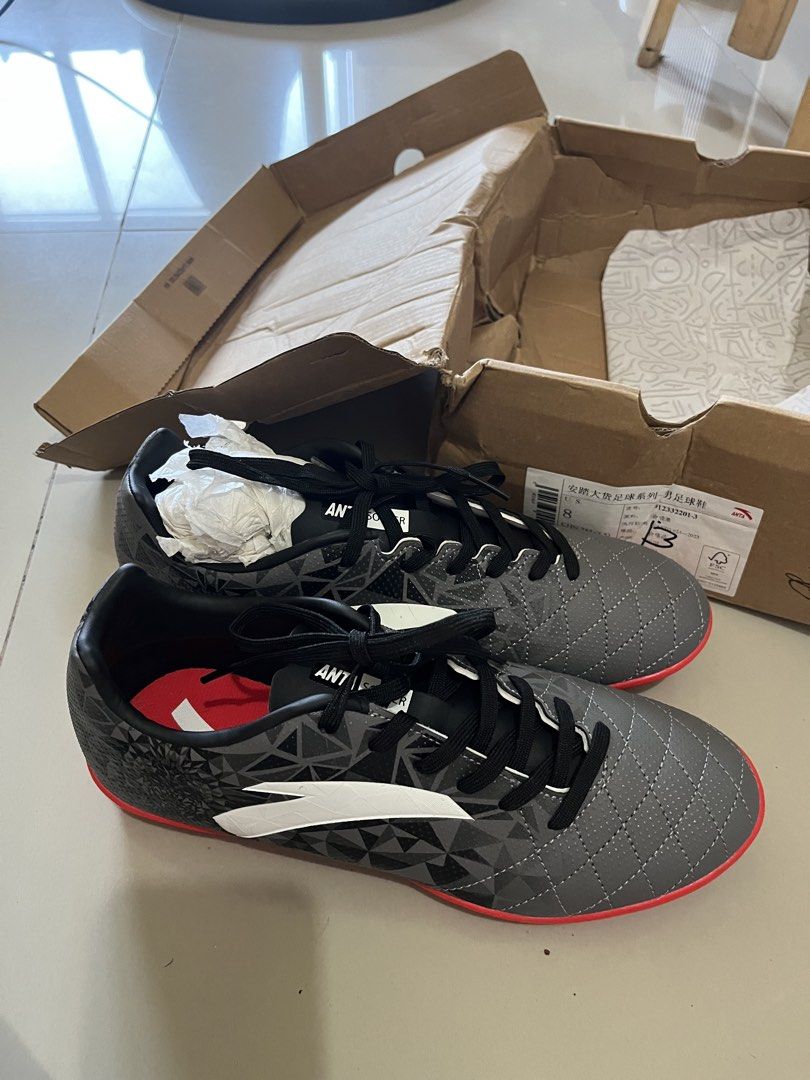ANTA Men's Soccer Football Shoes Size 8 (Category: Sneakers) located in Mandaluyong City. Submitted by _cfpl (Listing ID 1445041830, Image 1). Description: - ANTA Men's Soccer Cleats - Color: Grey with red accents and black laces - Size: 8 US / 41 EUR - Type: Turf shoes (ideal for artificial grass) - Condition: Recently bought, comes with original box Srp: 2995.
