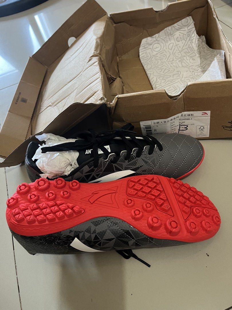 ANTA Men's Soccer Football Shoes Size 8 (Category: Sneakers) located in Mandaluyong City. Submitted by _cfpl (Listing ID 1445041830, Image 3). Description: - ANTA Men's Soccer Cleats - Color: Grey with red accents and black laces - Size: 8 US / 41 EUR - Type: Turf shoes (ideal for artificial grass) - Condition: Recently bought, comes with original box Srp: 2995.