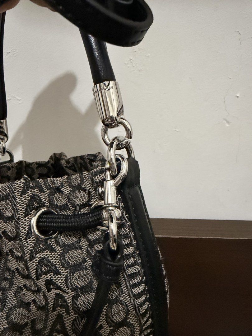 Authentic Marc Jacobs Mini Monogram Crossbody Bucket Bag (Category: Luxury Bags & Wallets) located in Cebu City. Submitted by shopnsave2015 (Listing ID 1445024649, Image 3). Description: With dustbag No flaws Missing sling In excellent condition Introducing the Marc Jacobs Mini Monogram Crossbody Bucket Bag, a perfect blend of sophistication and functionality. This exquisite accessory features a visually striking monogram design that enhances its