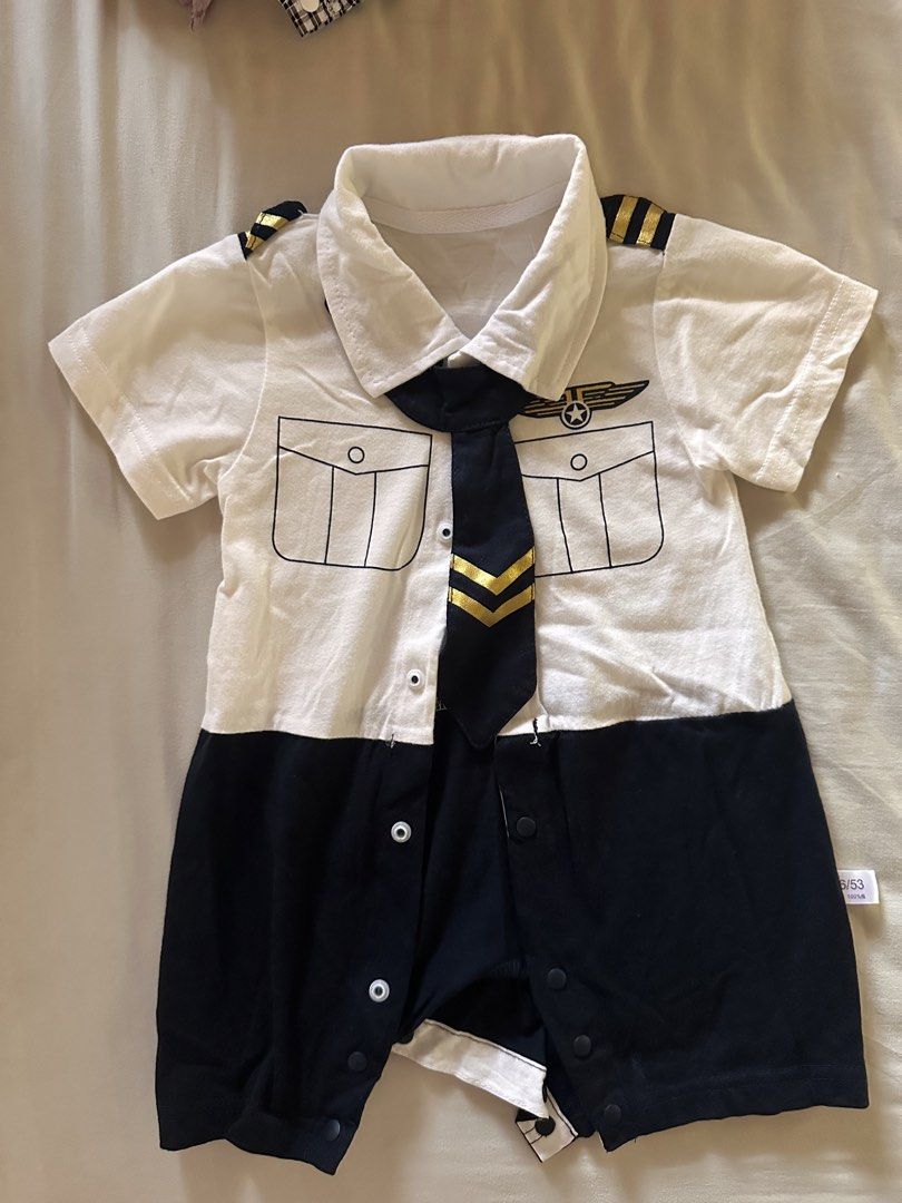 Baby Pilot Costume Romper Short Sleeve (Category: Babies & Kids Fashion) located in San Fernando. Submitted by angelajane92828 (Listing ID 1444918216, Image 1). Description: - Adorable pilot uniform baby romper - White top with navy blue shorts - Features faux tie and pilot wings emblem - Convenient snap closures at the bottom - Ideal for dress-up and photo opportunities.