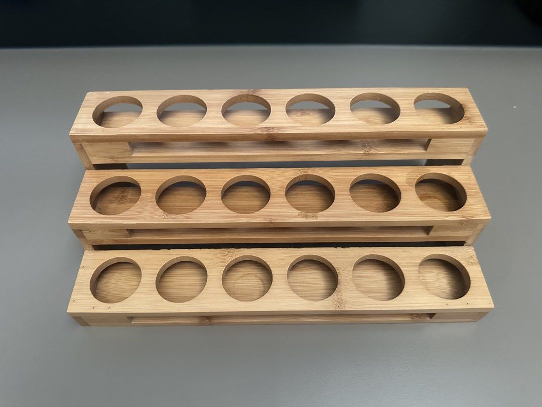 Bamboo Essential Oil Rack Holder Organizer (Category: Shelves, Cabinets & Racks) located in Las Pinas. Submitted by thejoyfulseller (Listing ID 1445042103, Image 1). Description: - Set of 3 bamboo racks - Each rack holds 6 bottles - Ideal for organizing essential oils or small bottles - Natural wood finish - Stackable or can be used separately.