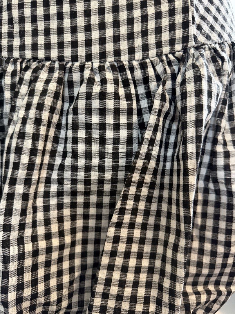 Black and White Gingham Strapless Bubble Dress (Category: Dresses) located in Quezon City. Submitted by dlm03 (Listing ID 1444904107, Image 2). Description: - Adorable strapless dress - Classic black and white gingham pattern - Comfortable smocked back for a perfect fit - Trendy bubble hem skirt - Versatile for casual days or parties - Easy to accessorize.