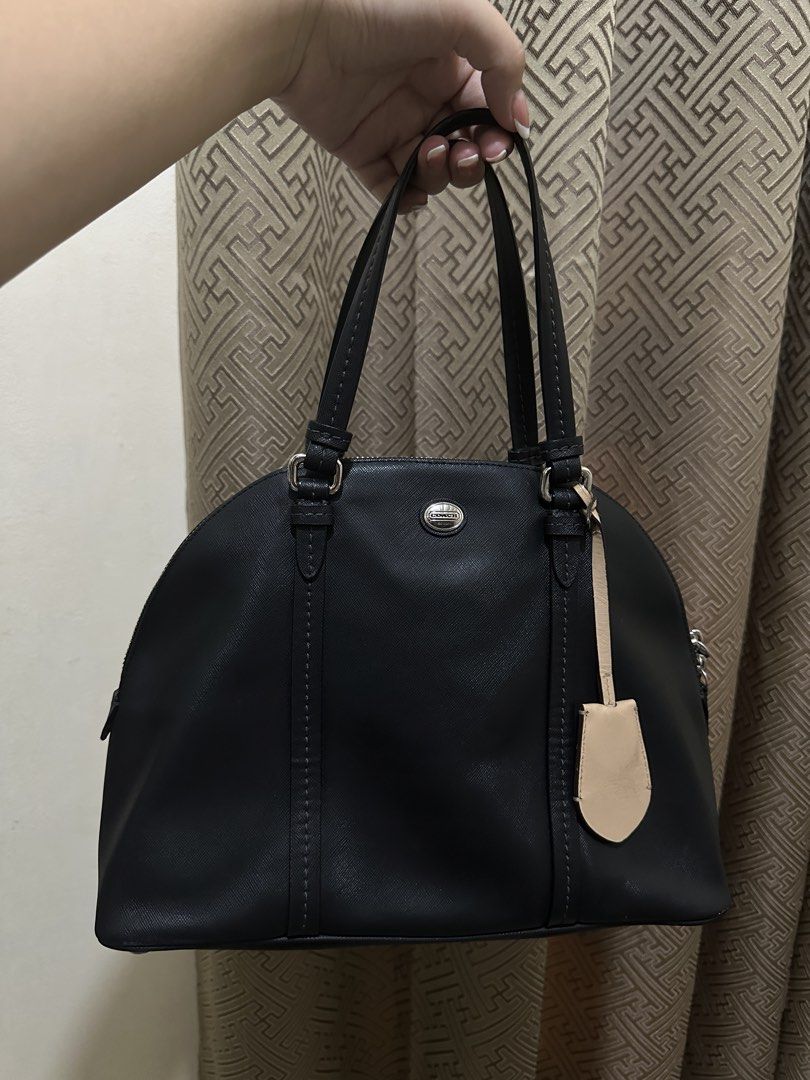 Black Coach Peyton Cora Domed Satchel (Category: Luxury Bags & Wallets) located in Las Pinas. Submitted by bagsbyshai (Listing ID 1444915700, Image 1). Description: black Coach Peyton Cora Domed Satchel made of Saffiano leather featuring a contrasting cream leather luggage tag.
