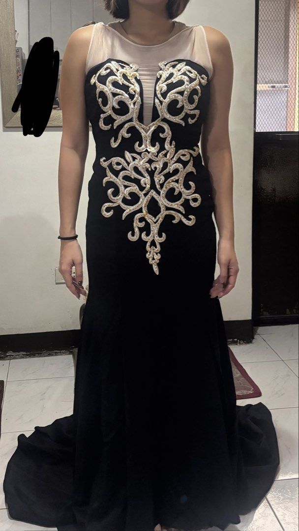 Black gown (Category: Evening dresses & gowns) located in San Juan City. Submitted by mxryldrn (Listing ID 1444904103, Image 1). Description: Used once for prom. Black gown with slit, no issues..